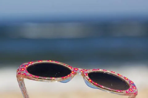 Sunglasses on the beach Stock Photos