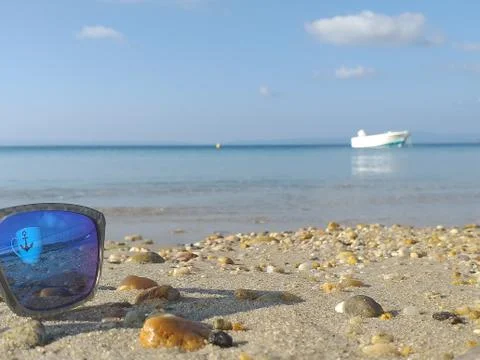 Sunglasses on a beach Stock Photos