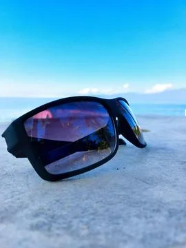 Sunglasses on the beach Stock Photos