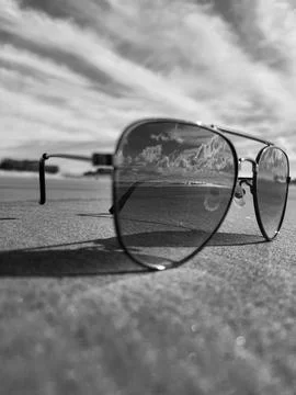 Sunglasses at the beach Stock Photos