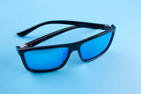 Sunglasses on blue background Stock Photos