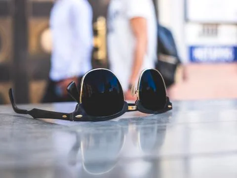 Sunglasses on a cafe table 스톡 사진