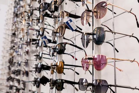 Sunglasses collection display rack store shop eyewear sale fashion accessories Foto stock