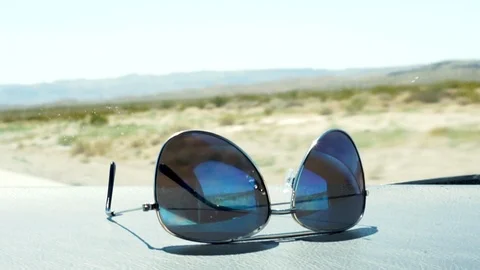 Sunglasses on the dashboard Stock Footage 115307488