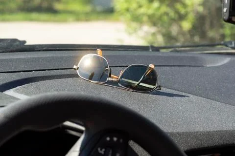 Sunglasses on the dashboard Stock Photos