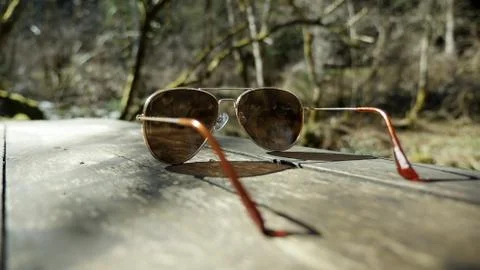 Sunglasses isolated on table in nature Stock Photos