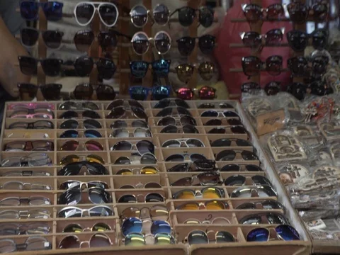 Sunglasses at the market Stock Footage 77677819