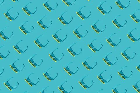 Sunglasses pattern on turquoise blue background with hard shadow Stock Photos