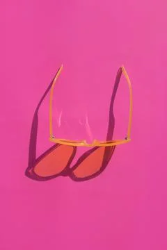 Sunglasses on pink background Stock Photos