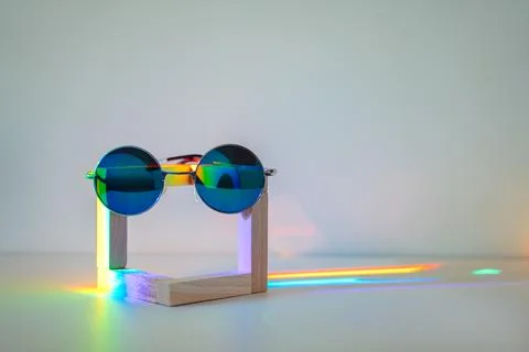 Sunglasses with rainbow reflection Stock Photos