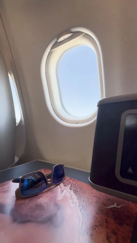 Sunglasses Resting on a Side Table in a Business Class Airplane Cabin Stock Footage 328079538