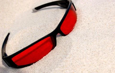 Sunglasses on sand Stock Photos