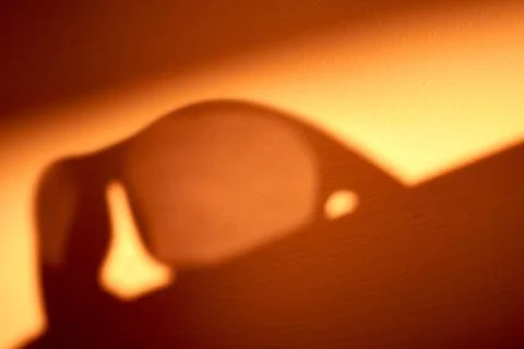 Sunglasses shadow on the wall Stock Photos