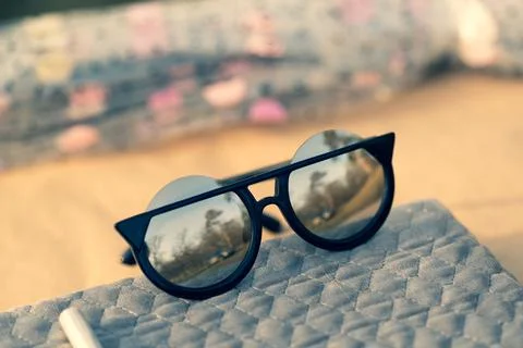 Sunglasses special model with big silver lenses for ladies with special design Stock Photos