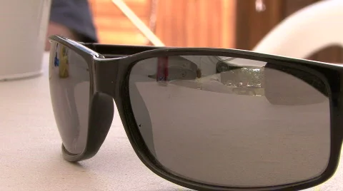 Sunglasses On Table Close Up Stock Footage 308185