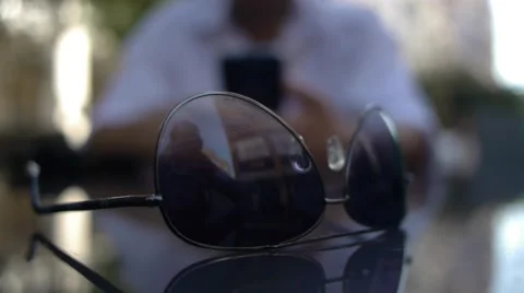 Sunglasses on the table Stock Footage 57664175