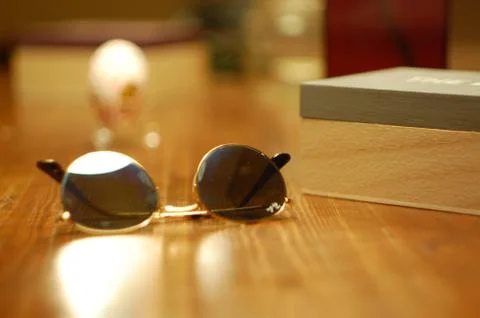 Sunglasses on table Stock Photos