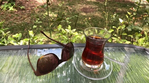Sunglasses with tea. 스톡 동영상 92613798