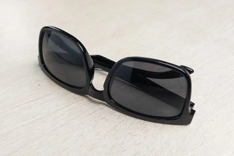 Sunglasses on the white table. Stock Photos