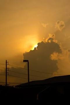 Sunhine behind cloud Stock Photos