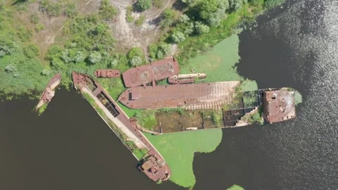 Sunken barges resting beneath the river's surface Stock Footage 261551827