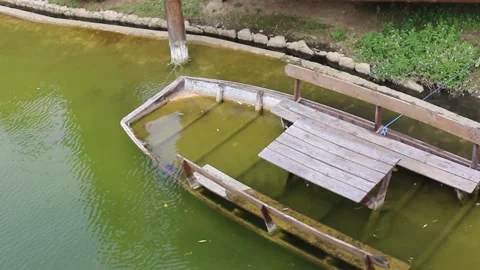 A sunken boat in a lake Stock Footage 141376783