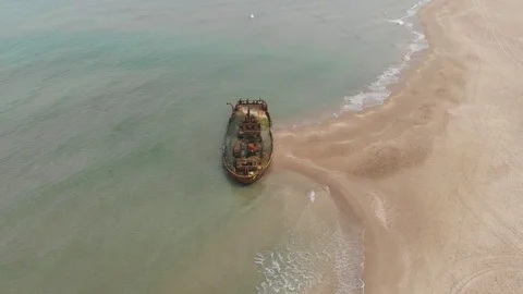 Sunken destroyed ship on the seashore. View from the drone. Stock Footage 113179820