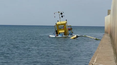 Sunken dredging barge in small port 動画素材 53854593