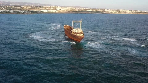 The sunken rusty ship has been lying on the rocks for many years. Stock Footage 139867239