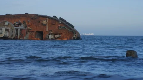 Sunken rusty ship lies on its side 1 Stock Footage 126971754