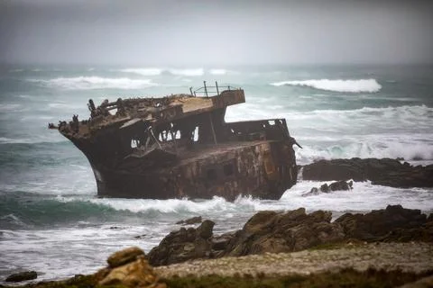 Sunken ship stranded at Cape Agulhas in South Africa. Stock Photos