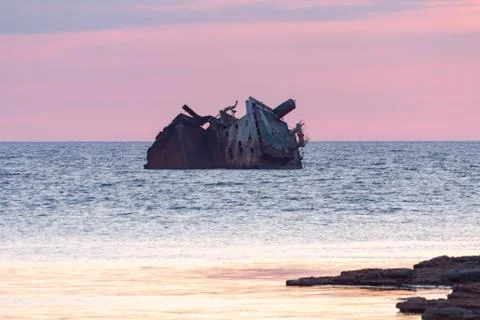 Sunken ship at sunset Stock Photos