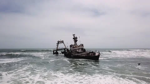 Sunken trawler, shipwreck. Old rusty metal ship Zeila at Skeleton Coast Namibia. 動画素材 176032508