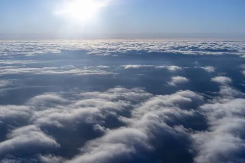 Sunlight above cloud layer from airplane window sky and clouds travel concept Фото