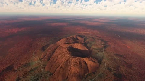 Sunlight aerial view of a monolith at Uluru. Australia Video stock 202053952