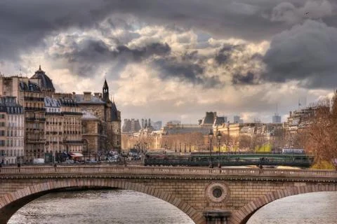 Sunlight and clouds over Pont Louis-Philippe Stock Photos