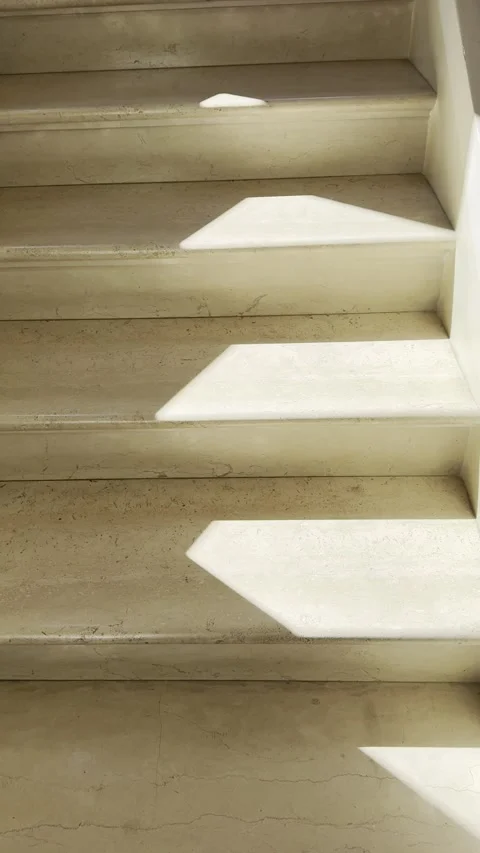 Sunlight and Shadow Across Historic Marble Stone Staircase Vertical Stock Footage 340453774
