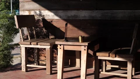 Sunlight and Shadow on Rustic Wooden Chairs Outdoors Stock-Footage 325236769