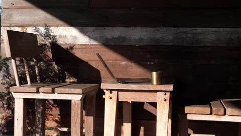 Sunlight and Shadow on Rustic Wooden Chairs Outdoors Video stock 325236855