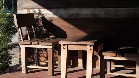 Sunlight and Shadow on Rustic Wooden Chairs Outdoors Video stock 325236910