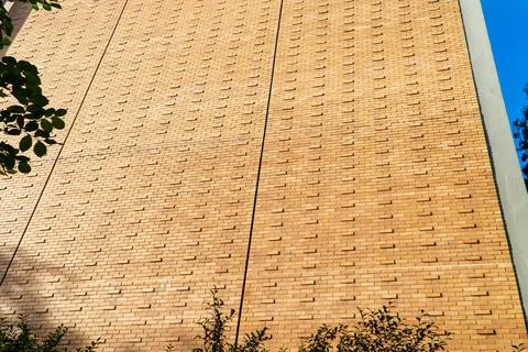 Sunlight and Shadows Highlight the Unique Pattern of a Modern Textured Bric.. Stock Photos