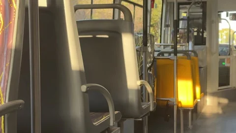 Sunlight and shadows inside moving public bus interior Stock Footage 331763355