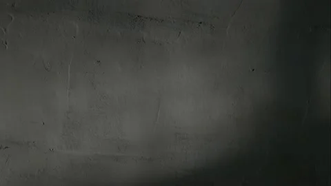 Sunlight and shadows move along the textured wall. Stock Footage 147342722