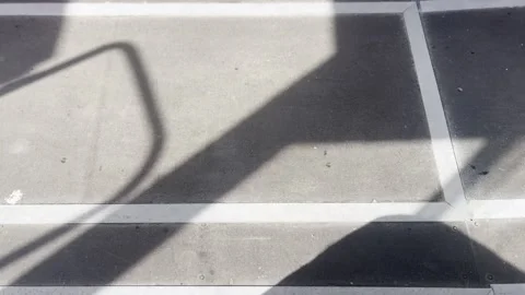 Sunlight and Sharp Shadows on Weathered Floor Surface with Metal Details Vídeos de archivo 342032464