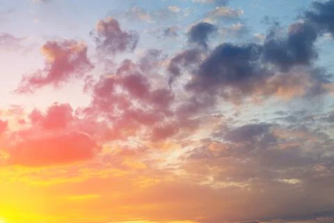 Sunlight and sun rays break through the clouds. Sunset time, summer mood Stock Photos