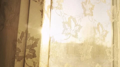 Sunlight in the apartment window through the curtain. Sunset, view from the Stock Footage 303142674