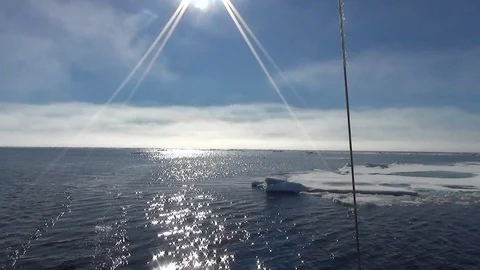 Sunlight on the Arctic Ocean seen from a sailing boat, North Pole Stock Footage 104874992