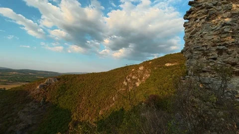 Sunlight bathes ancient stone ruins at golden hour. Soko Grad, Serbia 動画素材 345896884