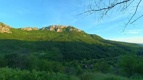 Sunlight bathes mountain ridges in golden glow. Sicevo Gorge, Serbia. Stock Footage 337052515