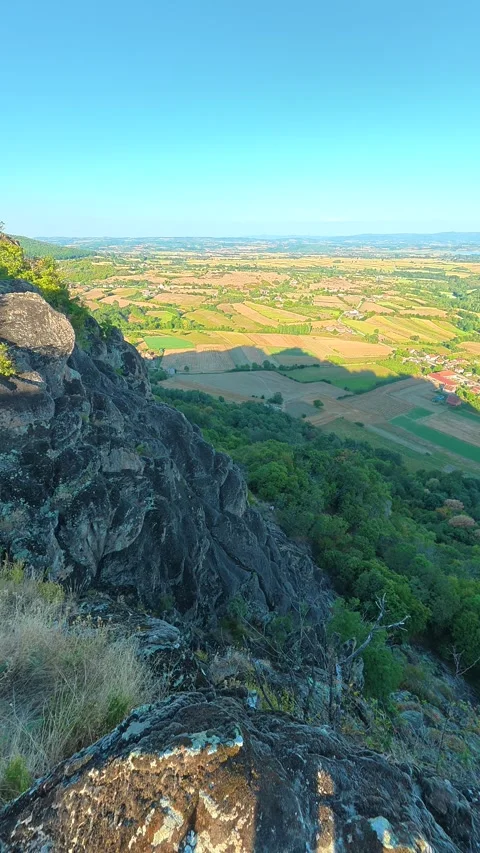 Sunlight bathes a rocky cliff edge. Boracki krs Serbia Vertical 動画素材 345006021